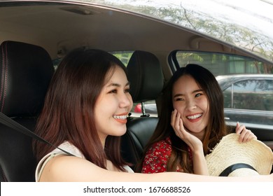 Two asian thai bestfriends travel together in the car. Cheerful female traveler on the road trip. - Powered by Shutterstock