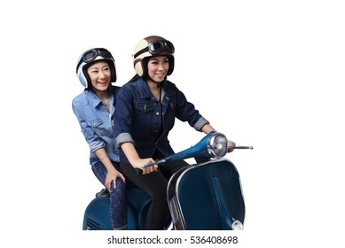 Two Asian Woman Having Fun When Riding The Scooter Isolated Over White Background