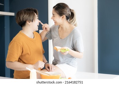 Two Asian Women Lgbtq Lesbian Homosexual Lesbian Couples Learning To Cooking Healthy Meals, Asian Woman LGBTQ+,LGBT,LGBTQ Home Kitchen.