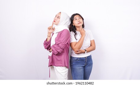 Two Asian Women Thinking Of Something Isolated With White Background