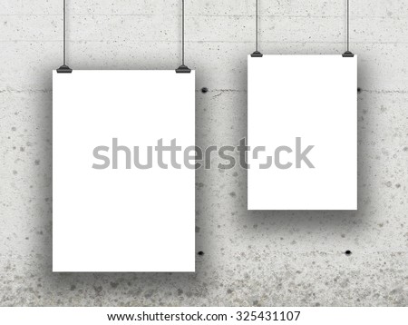 Two asymmetrical paper sheet frames on concrete wall background