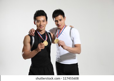 Two Athletes Wearing Medals