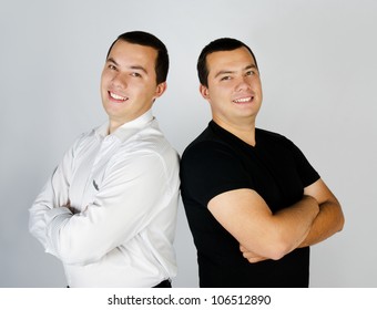 Two Attractive Positive Smile Young Men Twins