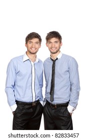 Two attractive positive smile young business people standing, dressed in shirt, tie. Concept Success, isolated over white background