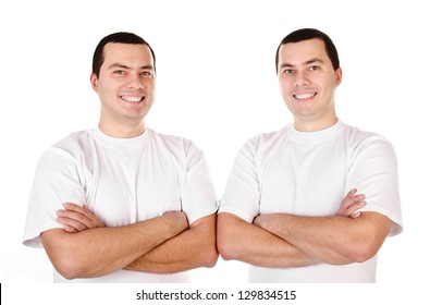 Two attractive positive smiling young men twins isolated on white