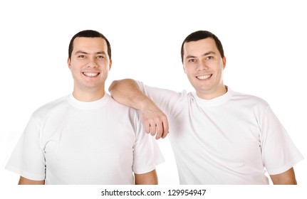 Two Attractive Positive Smiling Young Men Twins Isolated On White