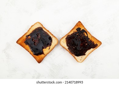 Two Aussie savory toasts for breakfast with thick Australian healthy food spread made from leftover brewers yeast extract.
