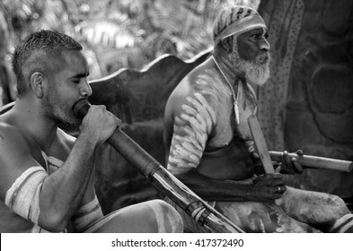 Two Australian  Aboriginal People Playing Aboriginal Music With Local Instruments On Aboriginal Culture Show In Queensland, Australia