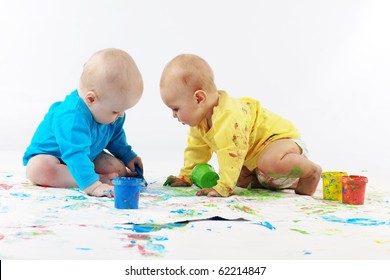 Two Babies Painting On White Background