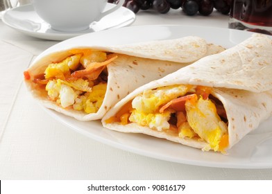 Two bacon and egg burritos with coffee