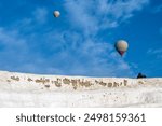 Two balloons in the skies of Pamukkale, Denizli. 