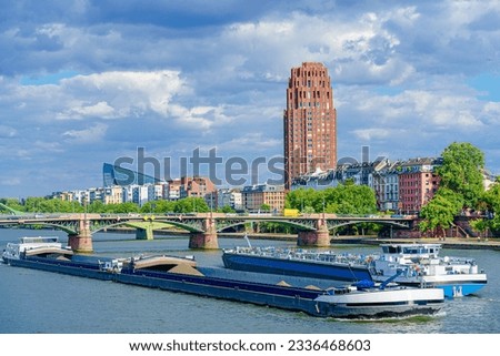 Two barges sail the River Main in Frankfurt, Germany