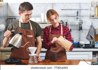 Two Baristas. A Guy And A Girl Working In A Coffee