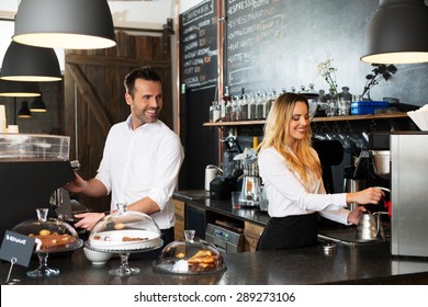 Two baristas preparing coffee at coffee-shop - Powered by Shutterstock