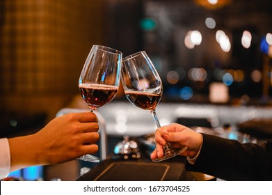Two Bartender Enjoying Of Cheers Glass Of Wine For Wine Tasting Event In A Restaurant  At Sunset. Bartender, Tasting, Dinner, Wine, Beverage, Dinner Concept.