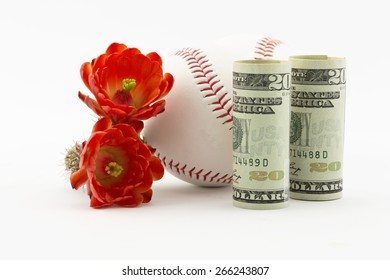 Two Baseballs With American Currency And Red Cactus Flowers.  Spring Training For Major League Baseball Has Practice And Exhibition Cactus League Games.  Sites Include Phoenix In Arizona. 