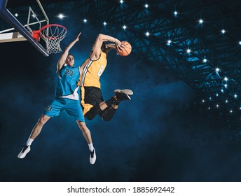 Two basketball players in action in arena. Blocked shot - Powered by Shutterstock