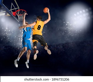 Two basketball players in action in arena. Blocked shot - Powered by Shutterstock