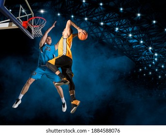 Two basketball players in action in gym - Powered by Shutterstock