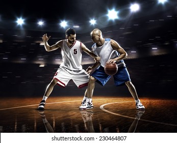 Two Basketball Players In Action In Gym