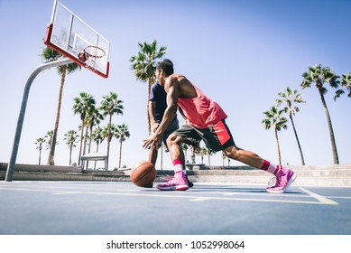 Two Basketball Players Playing Outdoor In LA