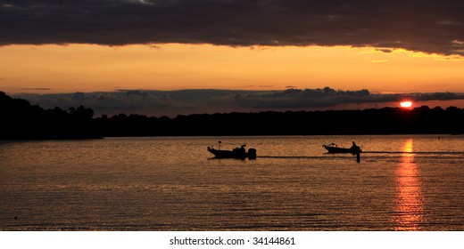 Two Bass Boats  Heading Home At The End Of Day