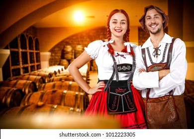 Two Bavarian peple and background of barrels 