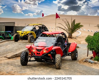 two beach buggies parked in the Namibian desert ready for adventure with tourists - Powered by Shutterstock