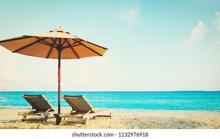 Two beach chairs on tropical vacation - Shutterstock ID 1132976918