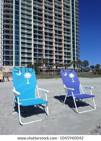 Two beach chairs at the seashore
