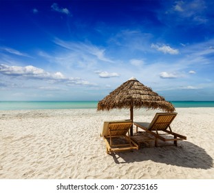 Two beach lounge chairs under tent on beach. Sihanoukville, Cambodia - Shutterstock ID 207235165