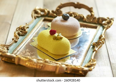 Two Beautiful Cakes On Vintage Tray