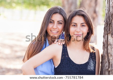 Similar – Happy women looking at camera over garden fence