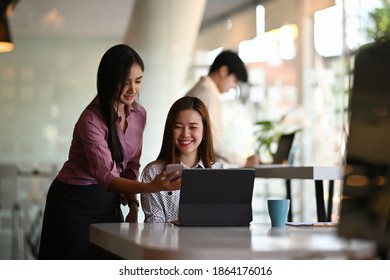 Two Beautiful Female Mobile Application Designers Are Test And Discuss New App Features In Meeting Room.