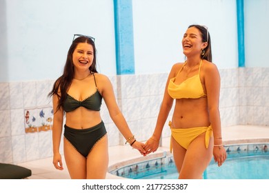 
Two Beautiful Hot Babes In Bikinis Walking Hand In Hand