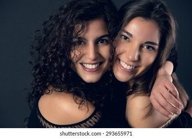 Two Beautiful Sisters Hugging Each Other.