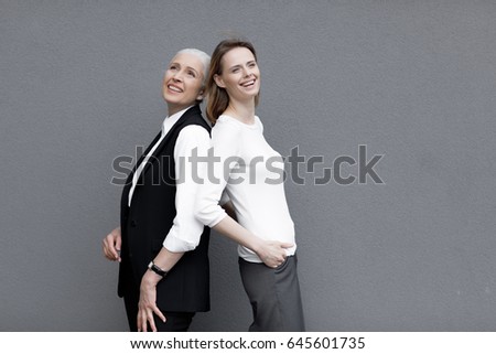 Similar – Image, Stock Photo happy twin sisters stand back to back