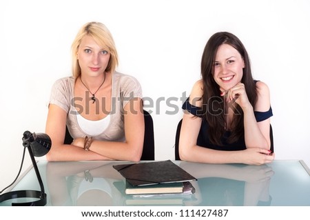 Two beautiful student girls getting ready for school isolated