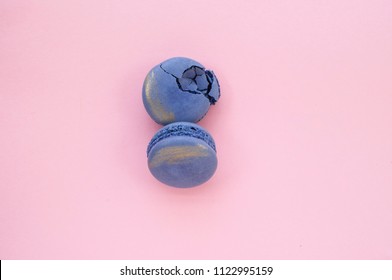 Two beautiful and tasty violet color macaroons with golden stroke on pink background. - Shutterstock ID 1122995159