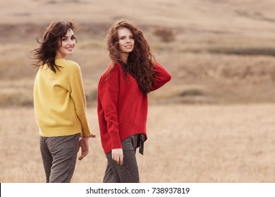 Two Beautiful Woman In Oversize Sweater Outside. Fashion Autumn Concept.