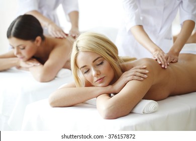 Two Beautiful Women Getting Massage In Spa