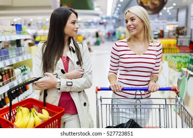 Two Beautiful Women Shopping Supermarket Stock Photo (Edit Now) 569184274