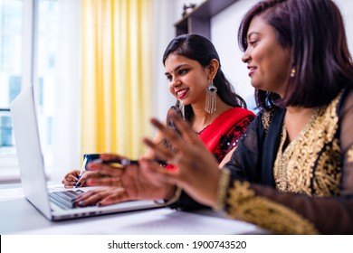 Two Beautiful Women In Tradition Sari Working At Office Or Cafe