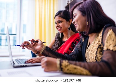 Two Beautiful Women In Tradition Sari Working At Office Or Cafe