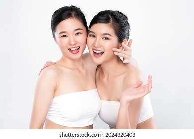 Two Beautiful young asian woman with clean fresh skin on white background, Face care, Facial treatment, Cosmetology, beauty and spa, Asian women portrait. - Shutterstock ID 2024320403
