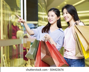 Two Beautiful Young Asian Woman Shopping In Mall Or Department Store