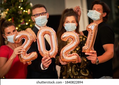 Two Beautiful Young Couples Having Fun At New Year's Eve Party