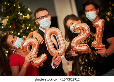 Two Beautiful Young Couples Having Fun At New Year's Eve Party