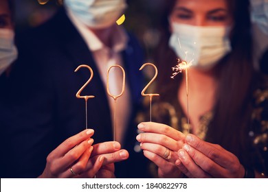 Two Beautiful Young Couples Having Fun At New Year's Eve Party