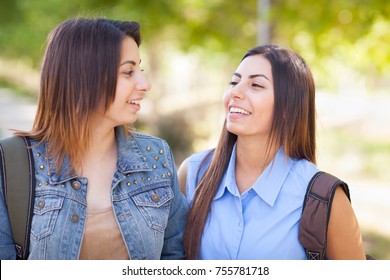 Two Beautiful Young Ethnic Twin Sisters With Backpacks Walking Outdoors. - Shutterstock ID 755781718
